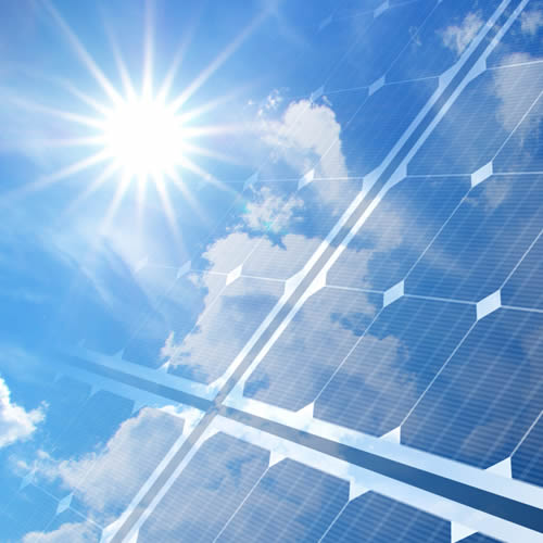 bright sunshine reflecting on a solar panel